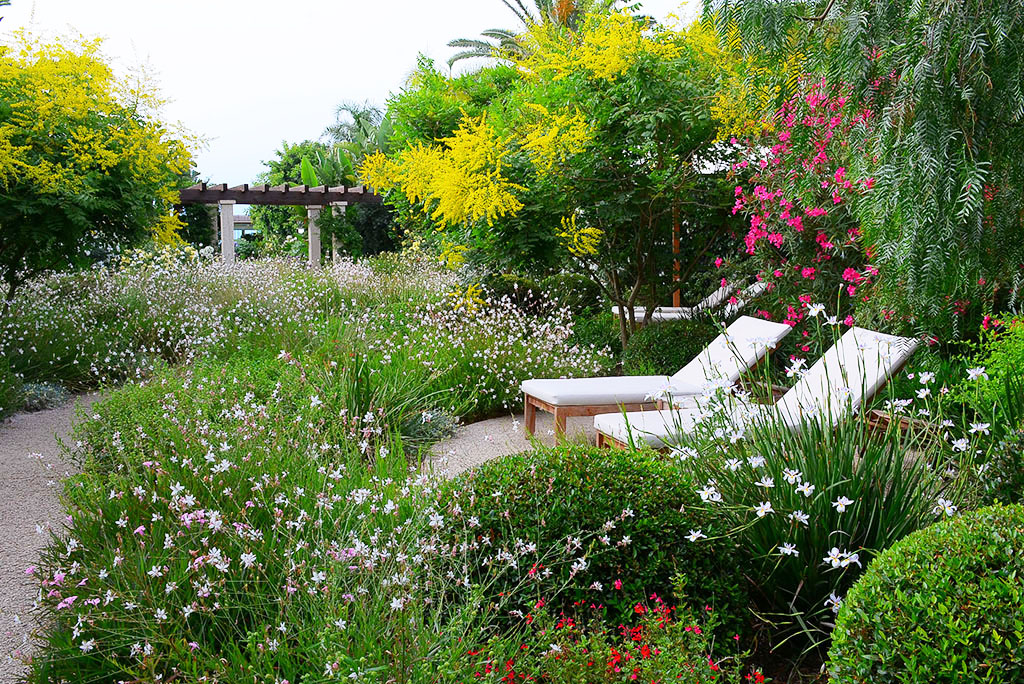 Lush tropical garden Is Prendas at Sant'Efis Hotel